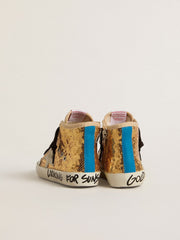 Young Francy Penstar in gold sequins with ice-gray suede star