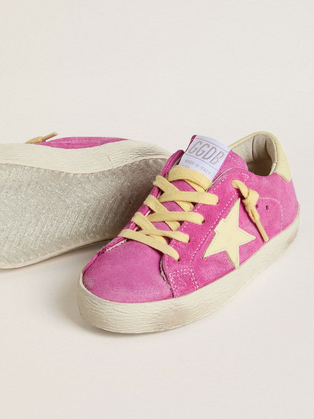 Junior Super-Star in pink suede with light yellow star and heel tab