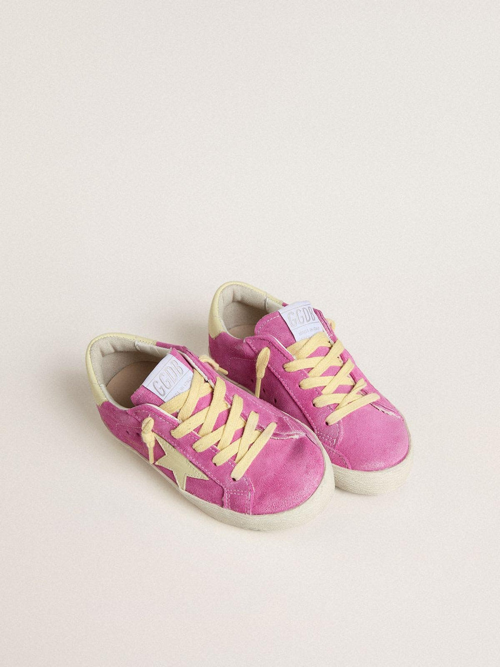 Young Super-Star in pink suede with light yellow star and heel tab