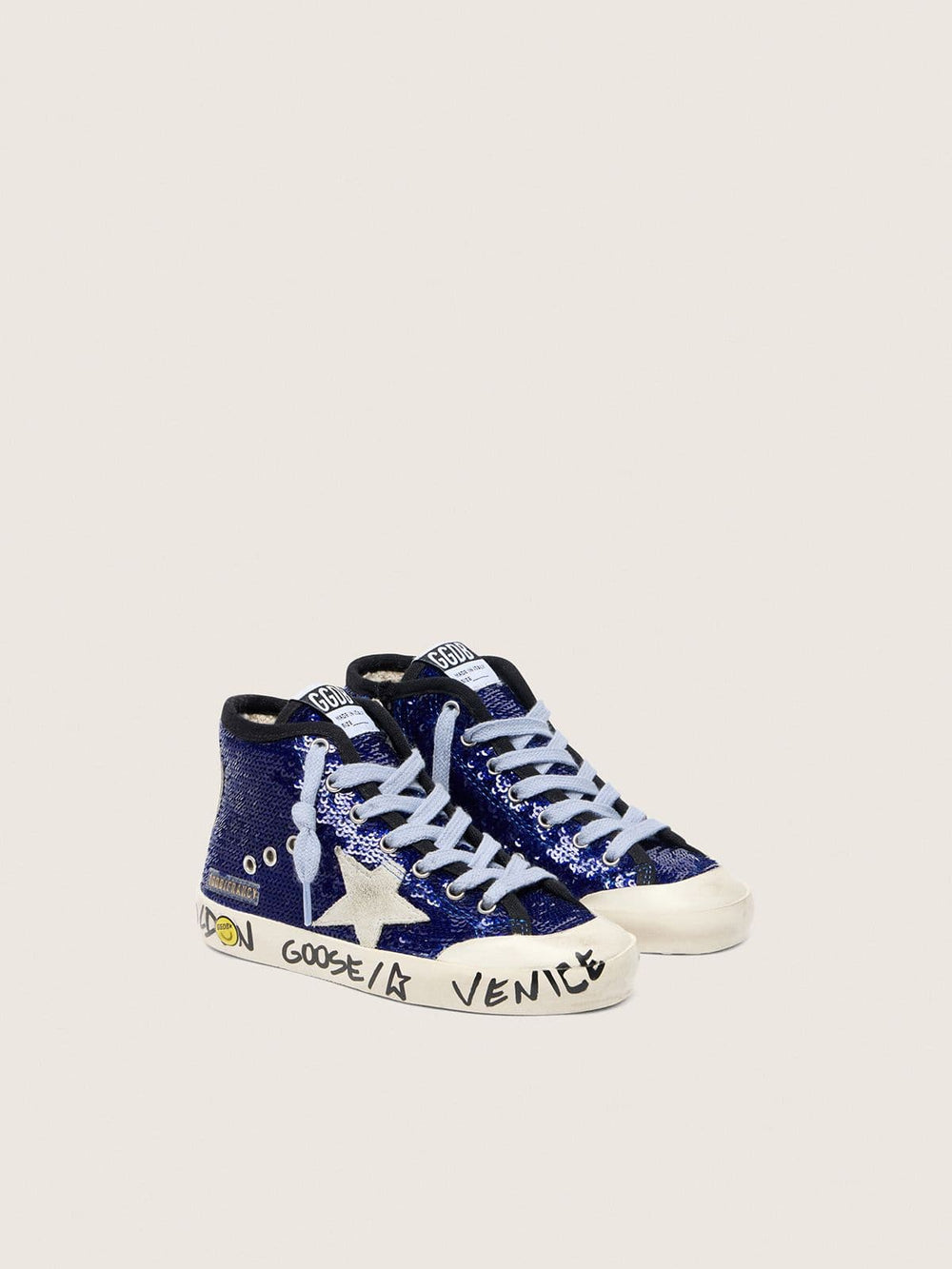 Young Francy Penstar in blue sequins with white suede star