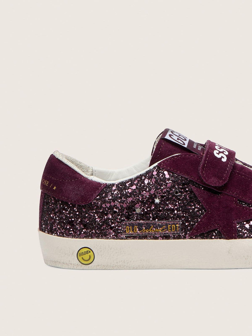 Young Old School in burgundy glitter with burgundy suede star and heel tab