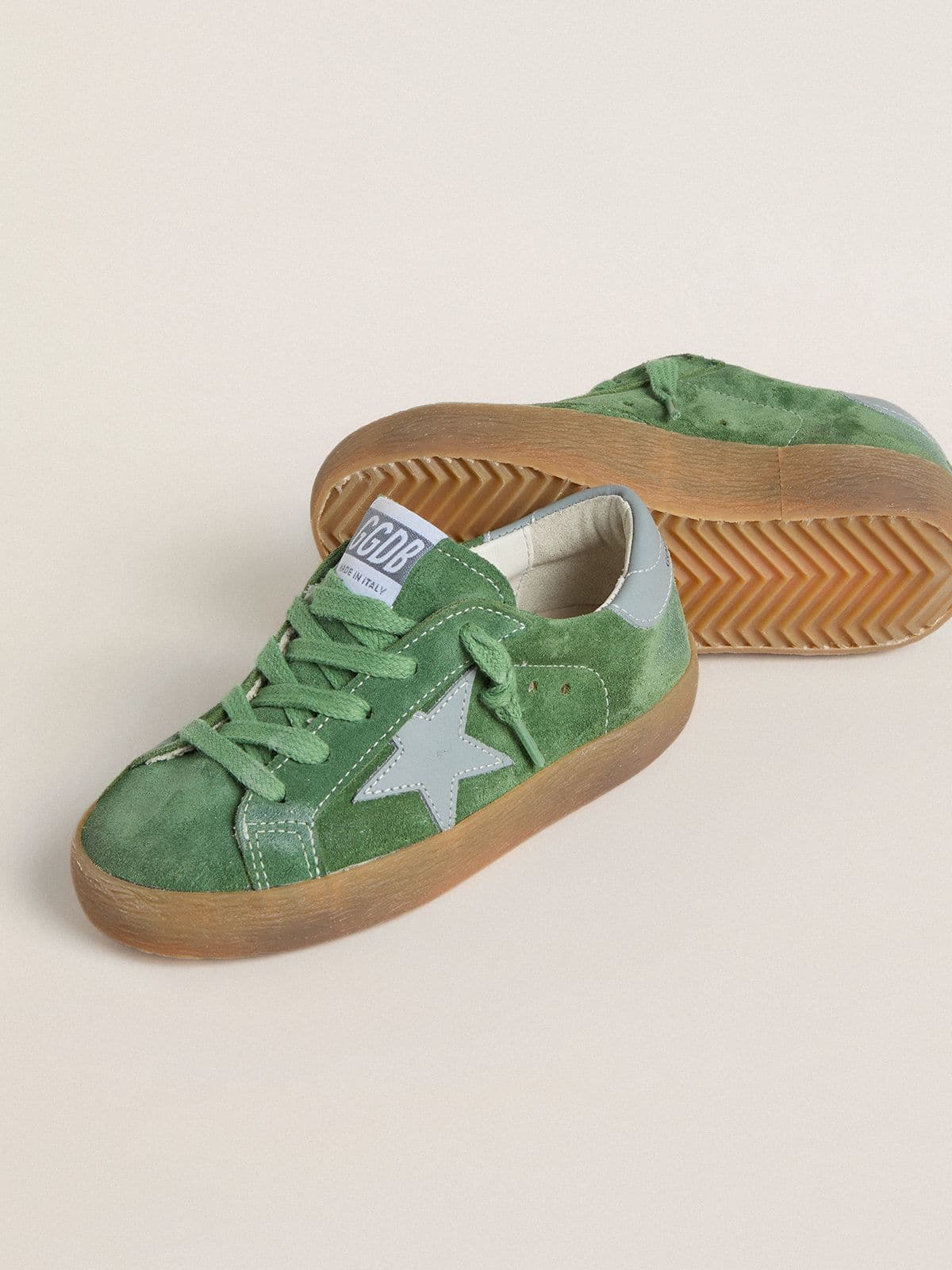 Junior Super-Star in green suede with baby blue star and heel tab