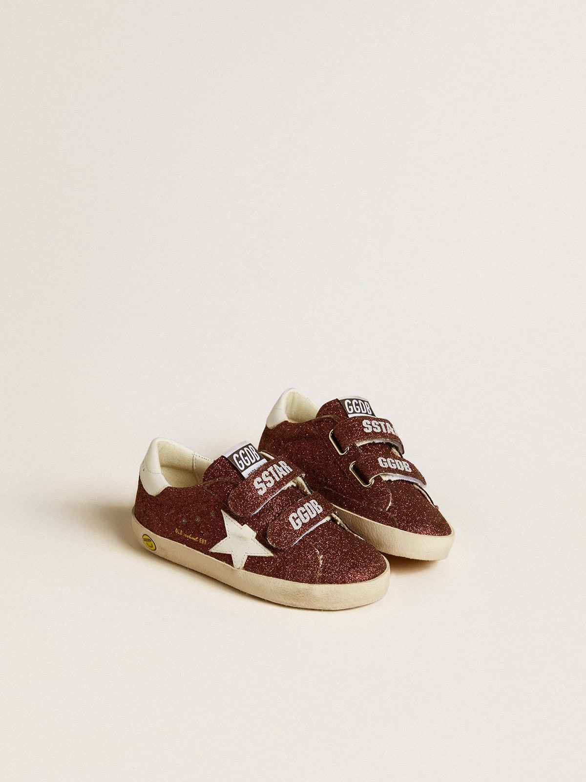 Old School Junior in burgundy glitter with leather star and heel tab
