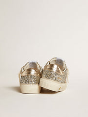 May Young in platinum glitter with metallic leather star and heel tab