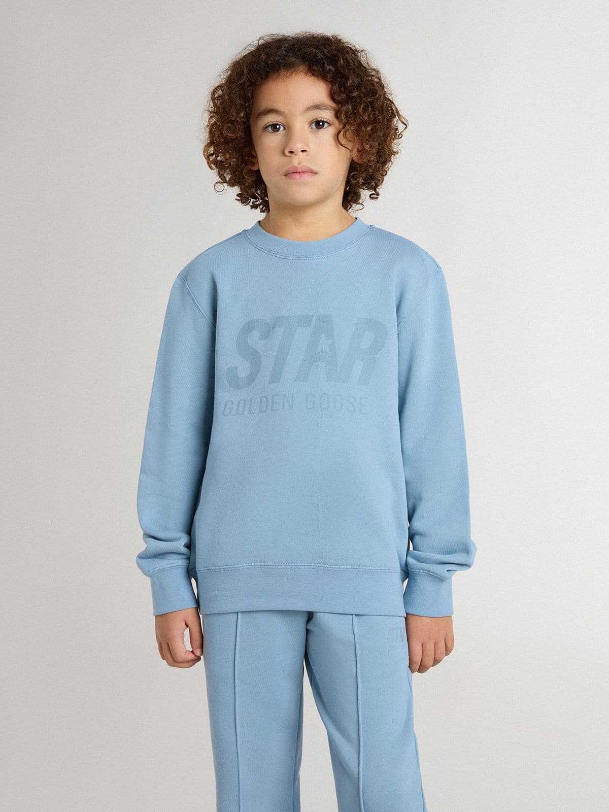 Boys' light blue sweatshirt with lettering on the front