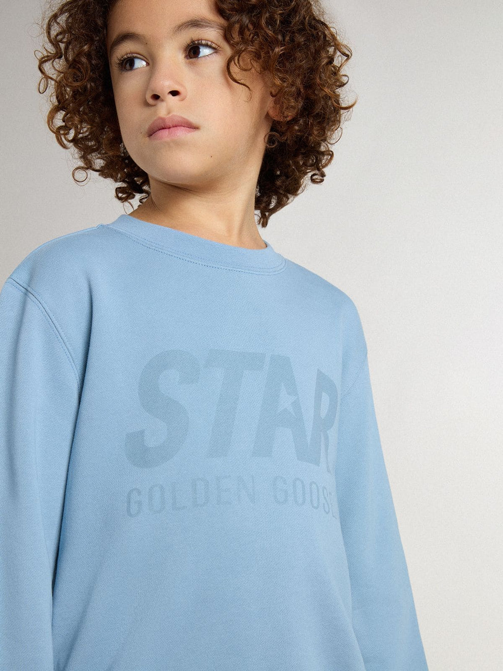 Boys' light blue sweatshirt with lettering on the front