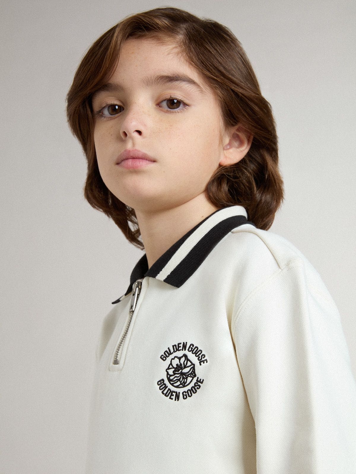 Kids white cotton polo sweatshirt with embroidery on the chest and print on the back