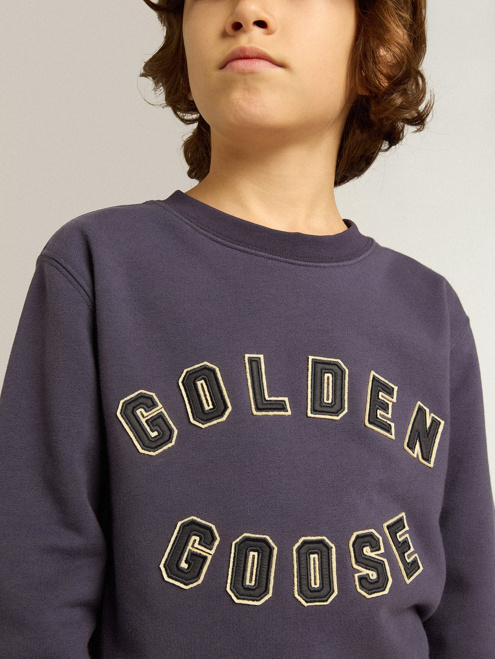 Blue-violet sweatshirt with Golden Goose lettering on the front
