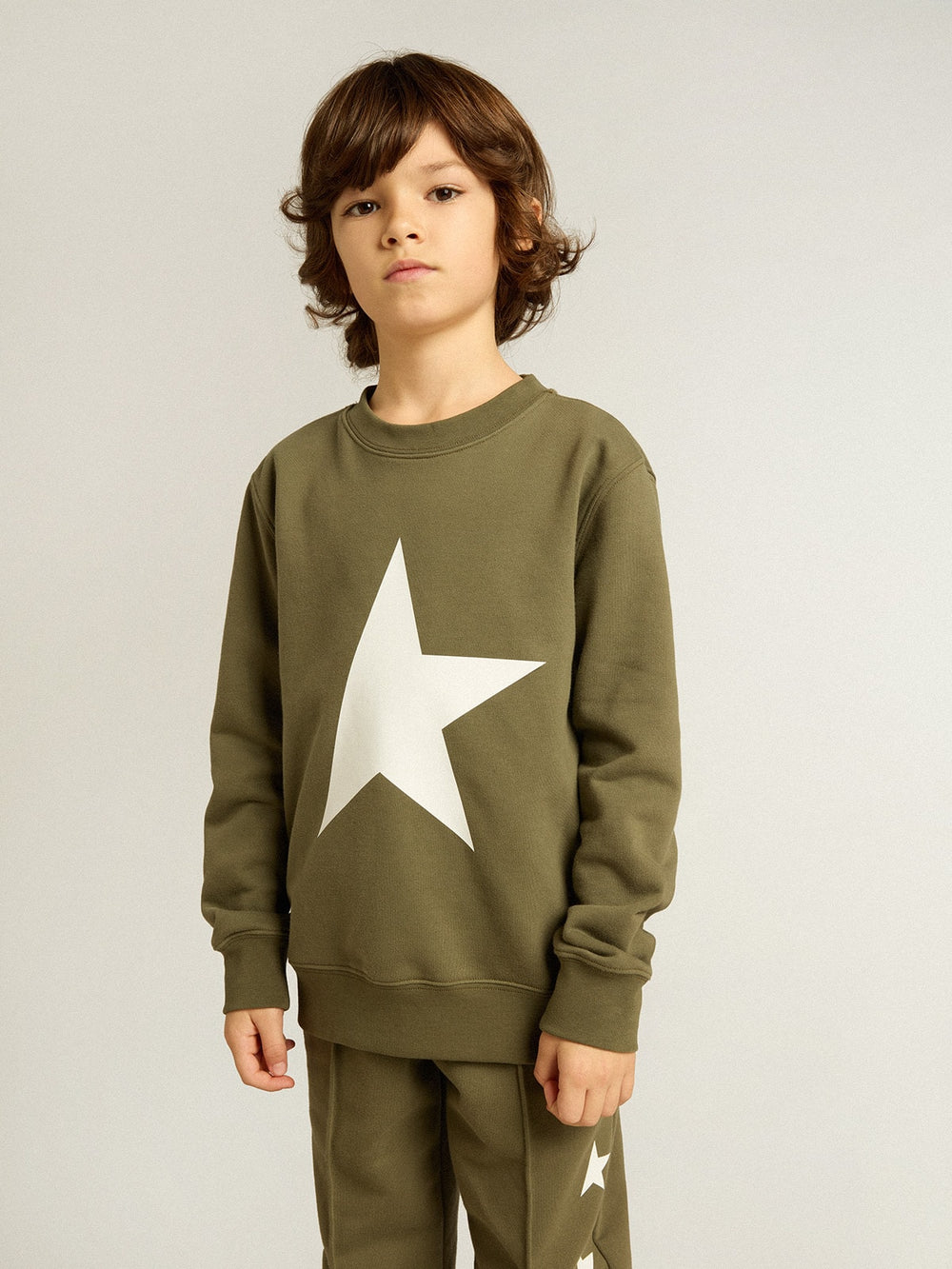 Boys' dark green sweatshirt with white maxi star on the front