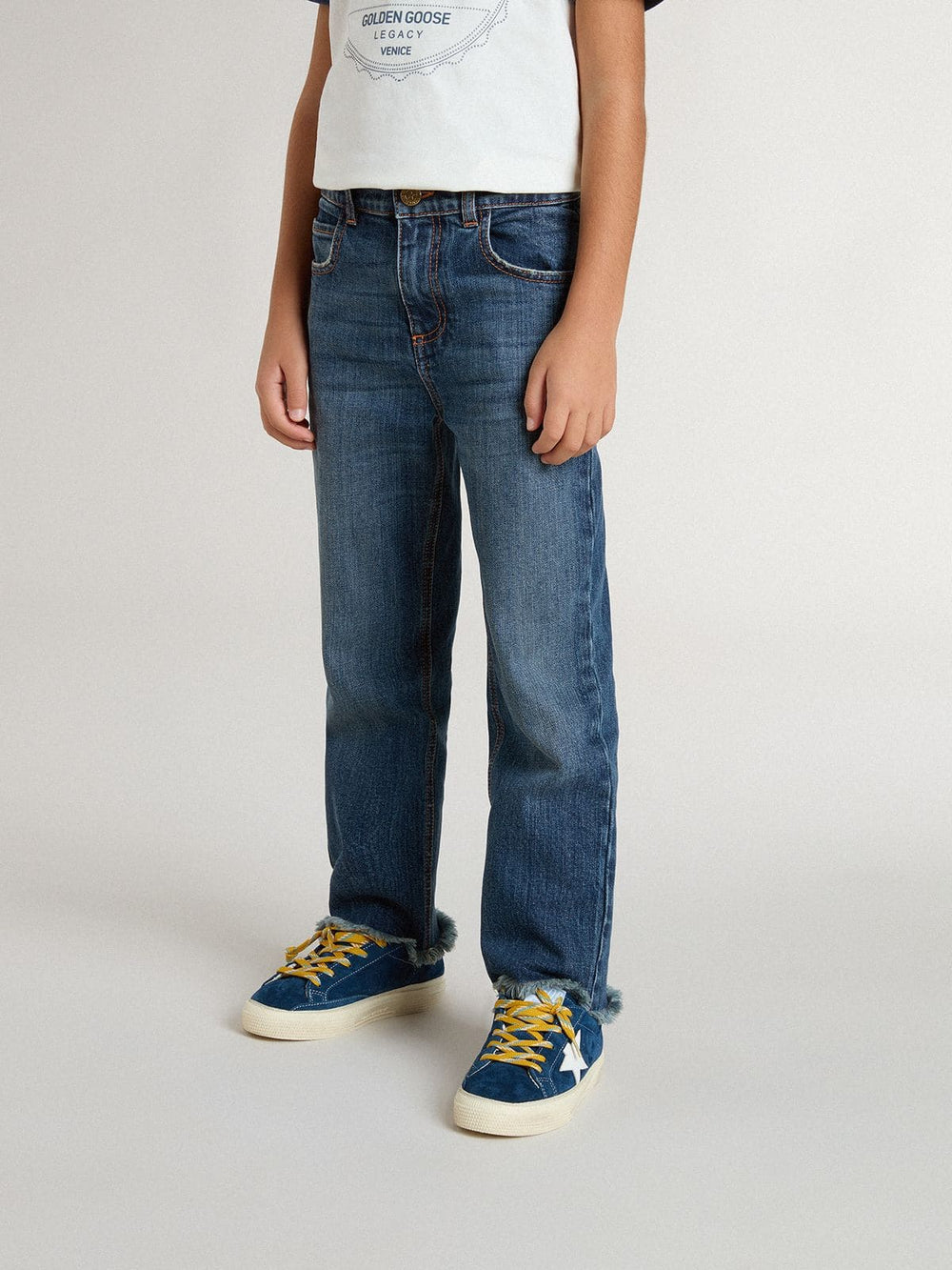 Boys' denim jeans with a raw edge and embroidery