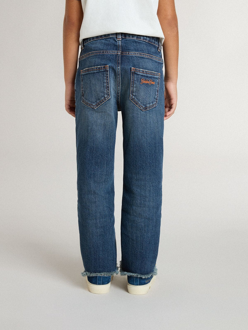 Boys' denim jeans with a raw edge and embroidery