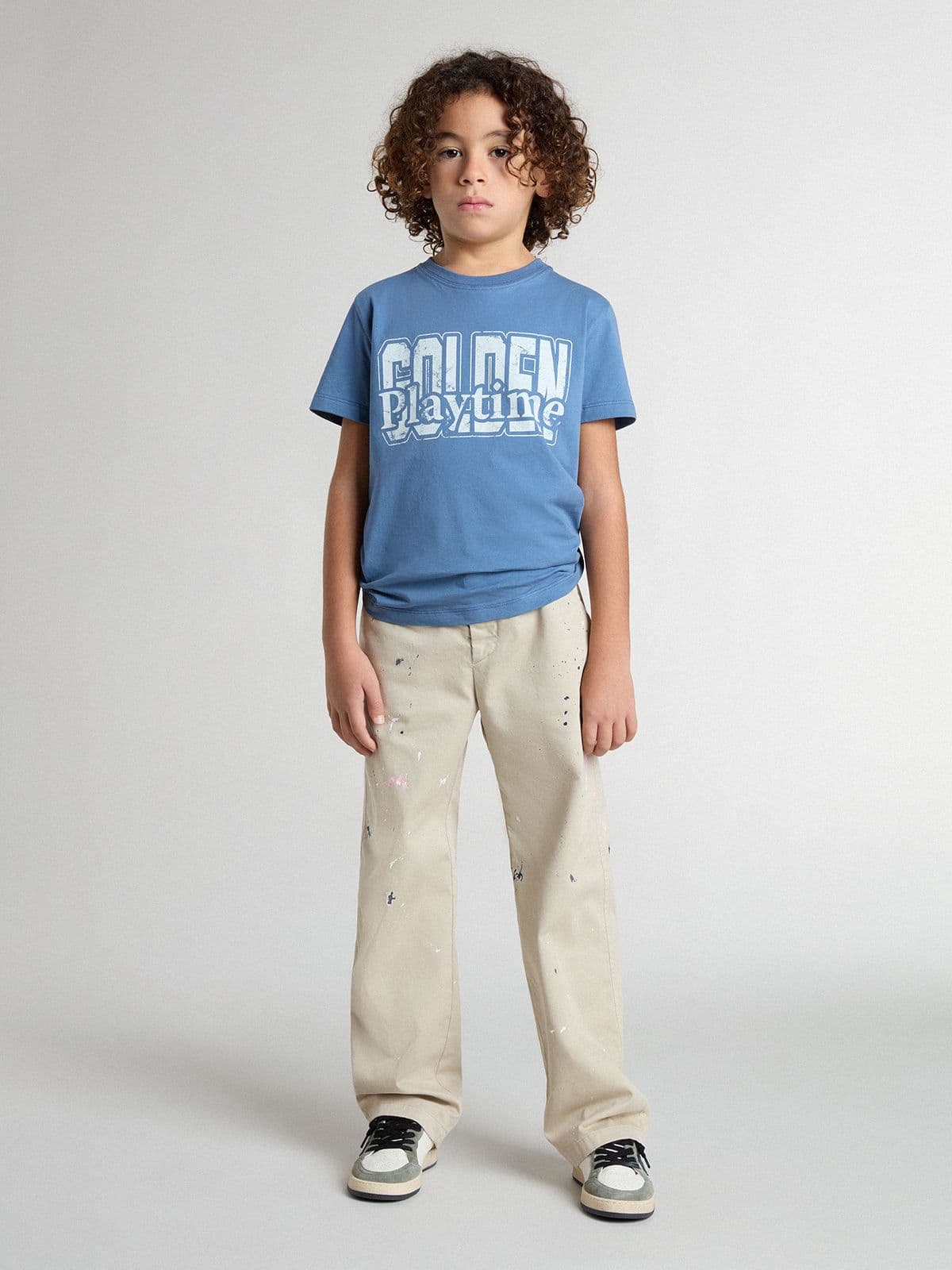 Kids’ beige chino pants with multicolor splashes