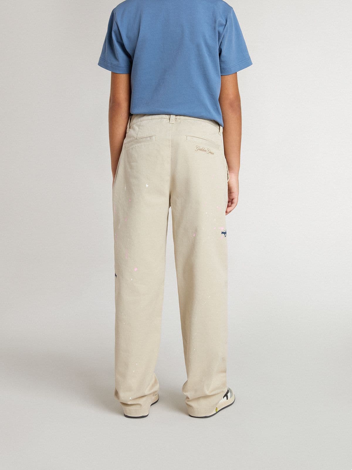 Kids’ beige chino pants with multicolor splashes