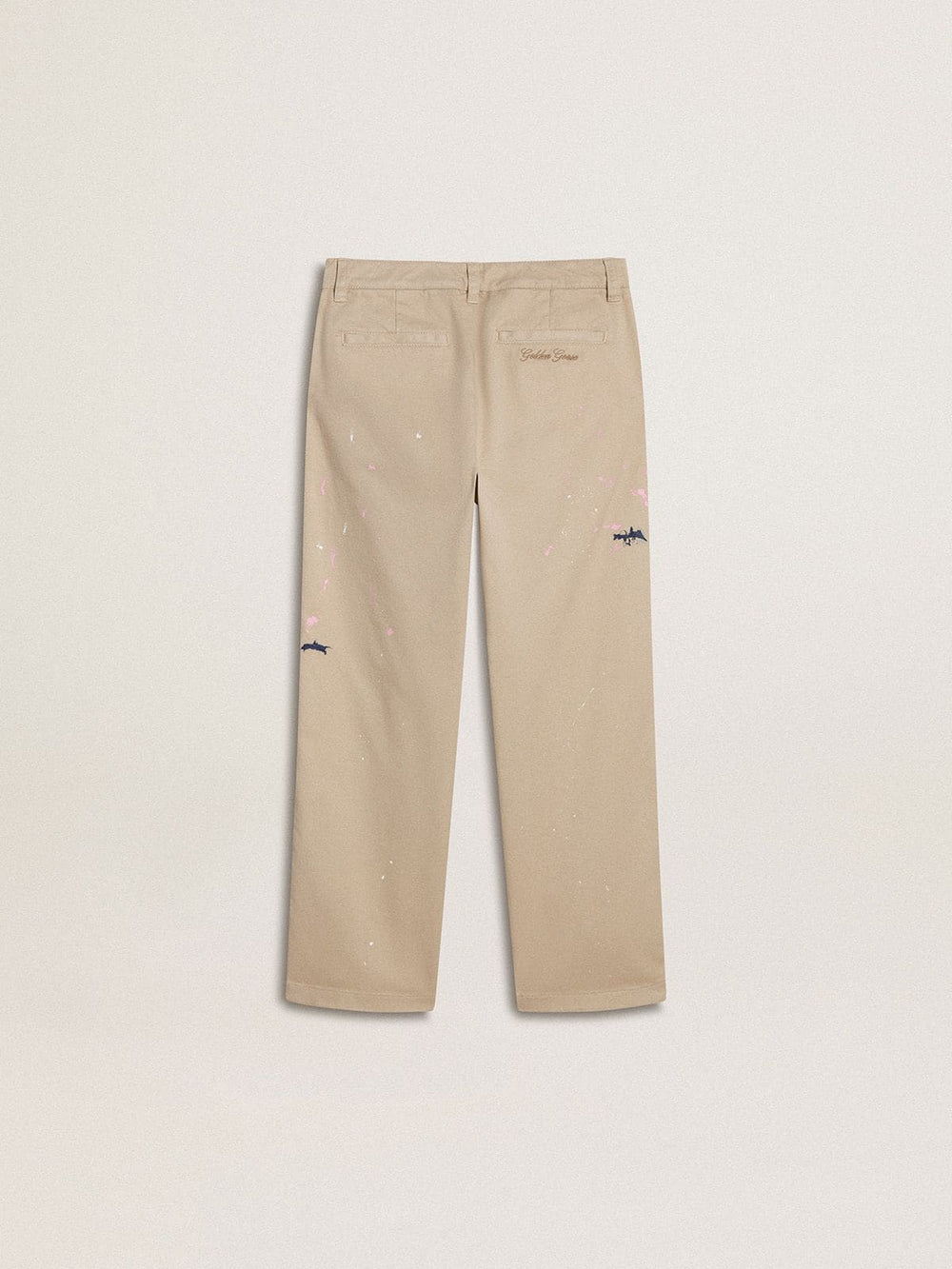 Kids’ beige chino pants with multicolor splashes