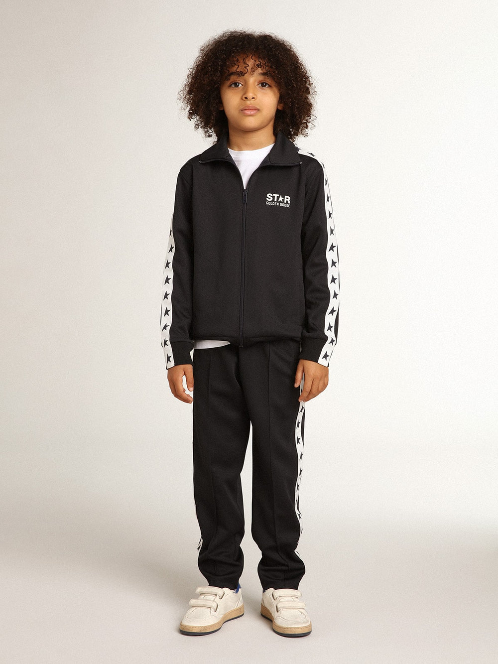 Dark blue joggers with white strip and contrasting stars