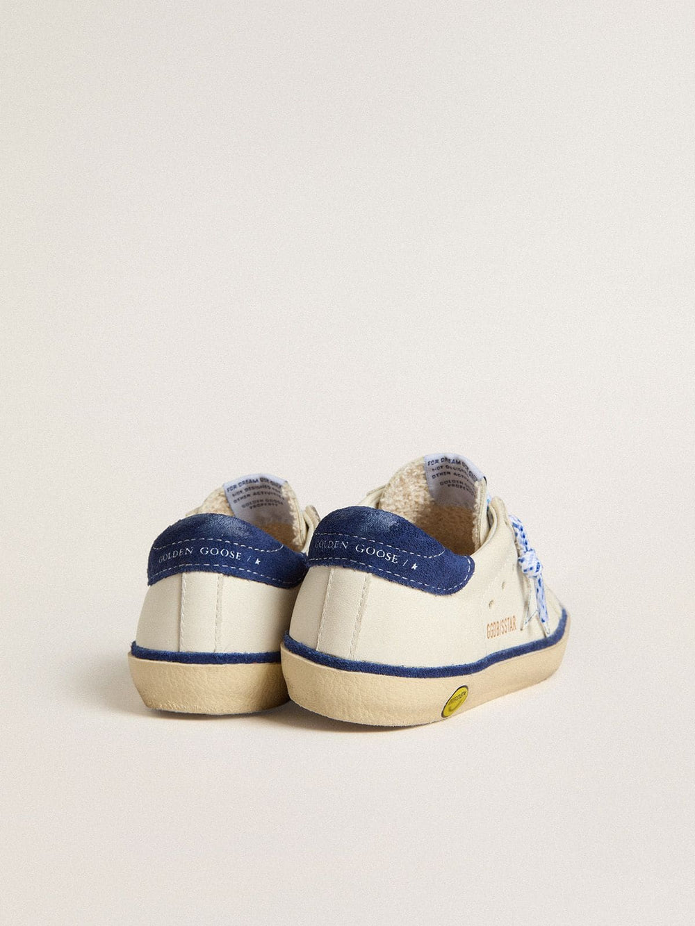 Junior Super-Star in white leather with blue suede heel tab