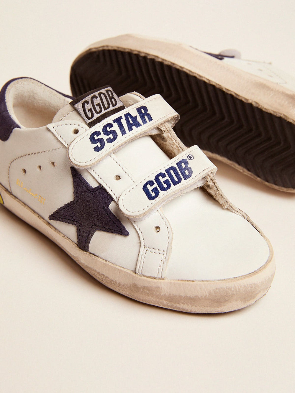 Old School Young in white leather with blue suede star and heel tab