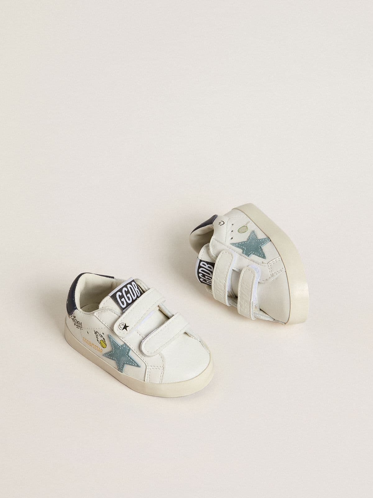 Baby School in white nappa with light blue suede star and tennis motif